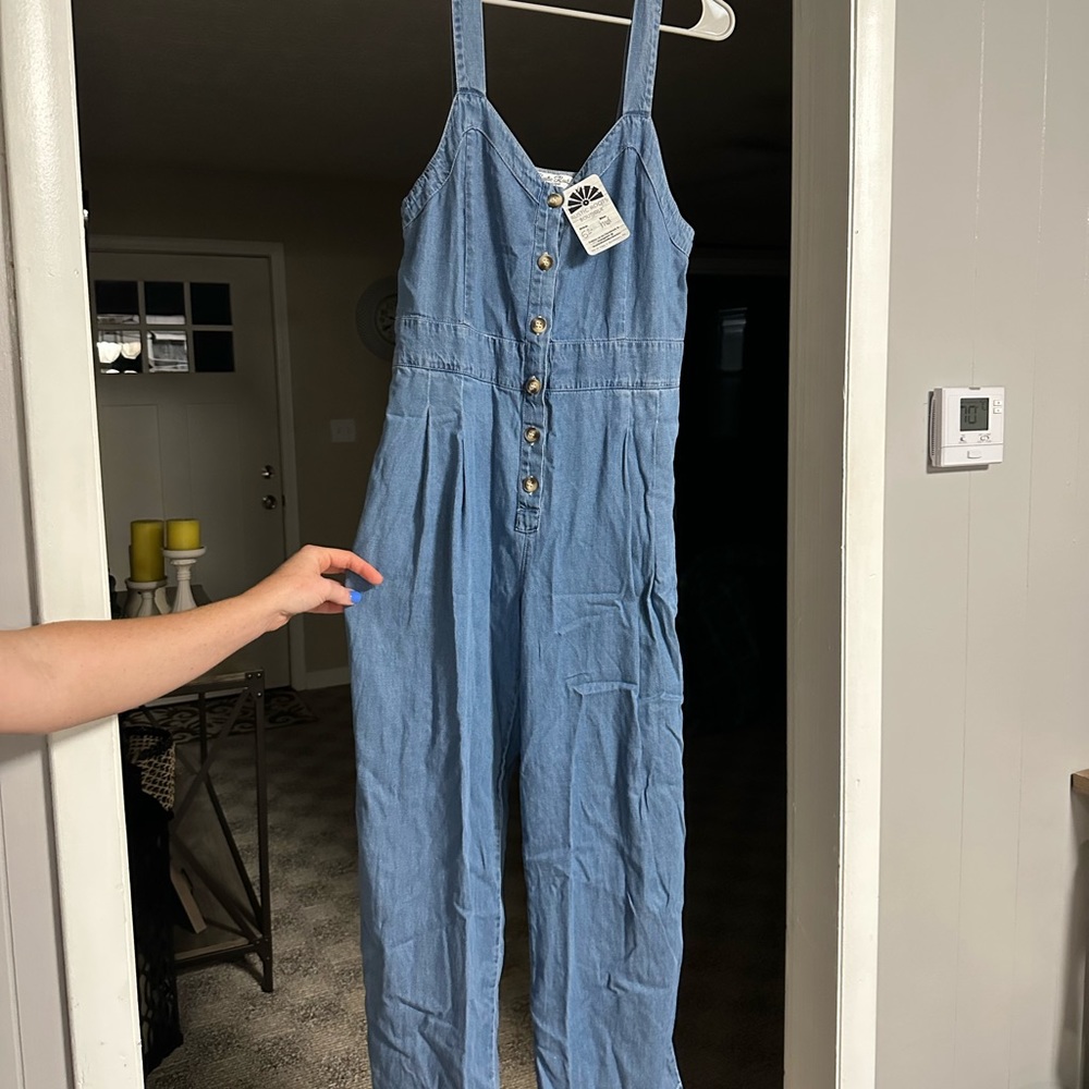 BRAND NEW jumpsuit from Rustic Roots Boutique. New with tags, just doesn’t fit.